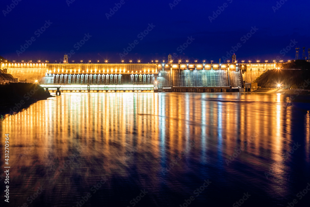 View of the hydroelectric dam, backlit