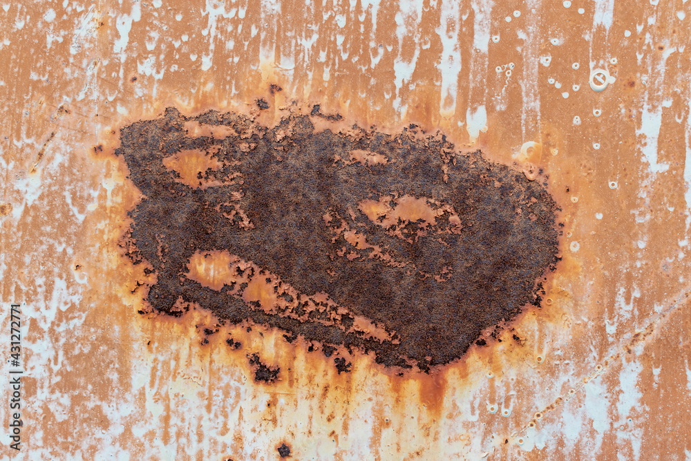 Fototapeta premium Rusty stain on metal. Surface finish - old orange paint with white smudges. Swelling, scratches.