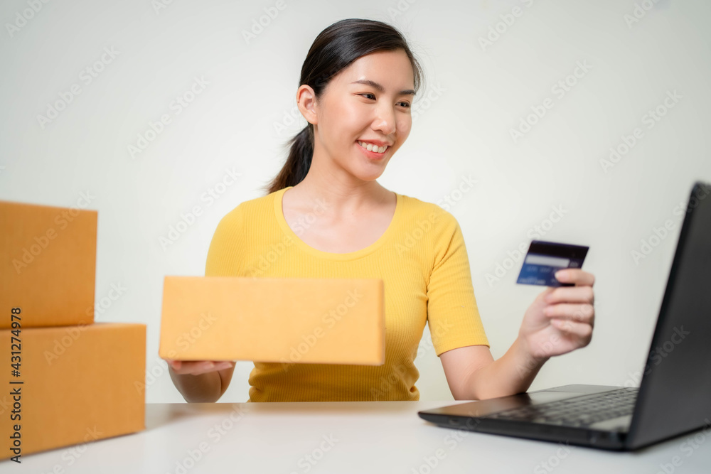 Asia woman Start up for Business Online. People with online shopping SME entrepreneur or freelance working concept. Banner size Asia woman Start up for Business Online. People with online shopping SME entrepreneur or freelance working concept. Banner size
