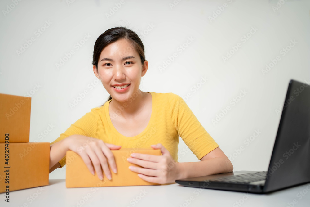 Asia woman Start up for Business Online. People with online shopping SME entrepreneur or freelance working concept. Banner size Asia woman Start up for Business Online. People with online shopping SME entrepreneur or freelance working concept. Banner size