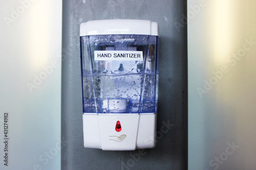 Hand sanitizer. Hand sanitizer in a public place against a wall in a public place.