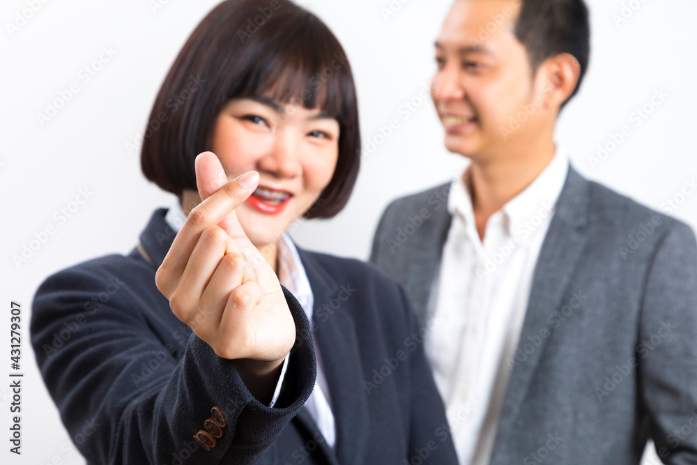 Happy business man and woman showing thumb up over white background. Happy business man and woman showing thumb up over white background.