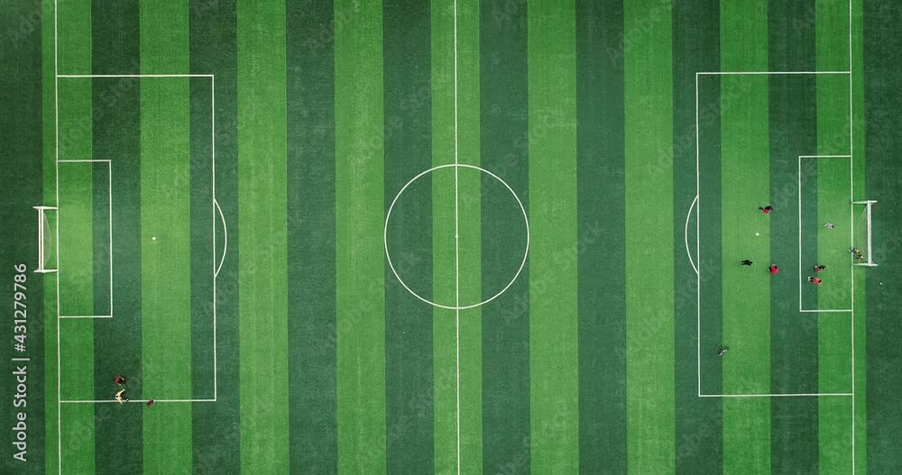 Aerial view of parents and children playing on the soccer field