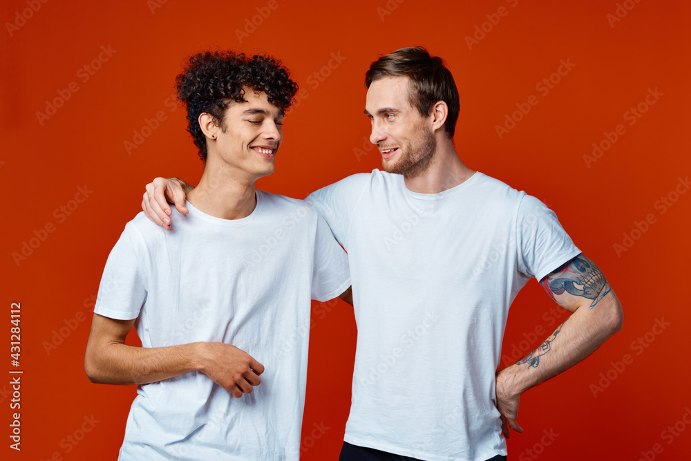 Two cheerful men on t-shirts communication friendship Two cheerful men on t-shirts communication friendship