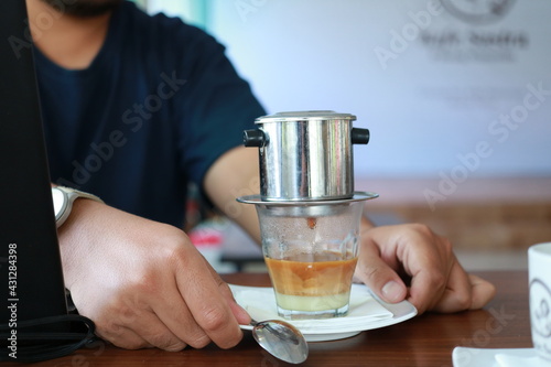 Vietnam Drip Coffee. Traditional Method of vietnamese coffee. dripping coffee on condense milk