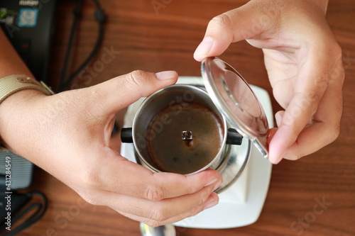 Vietnam Drip Coffee. Traditional Method of vietnamese coffee. dripping coffee on condense milk