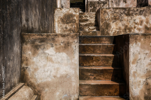 Stairs in a mossy old building for background