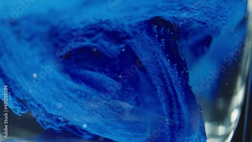 Abstract, colorful vivid background moving in slow motion. Macro shot of flowing liquids, splashing energy. Abstract backdrop, wallpaper, motion graphics.