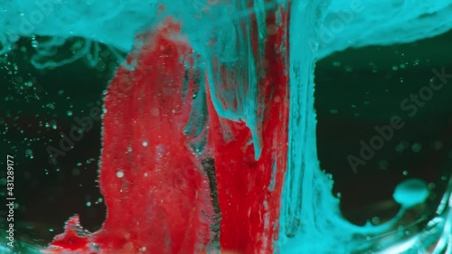 Abstract, magic background, shiny particles moving in slow motion, creativity, motion graphics. Liquids forming strange formations in macro shot.