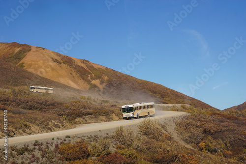Denali Tour Bus on dusty Road in Natinal Park, Alaska