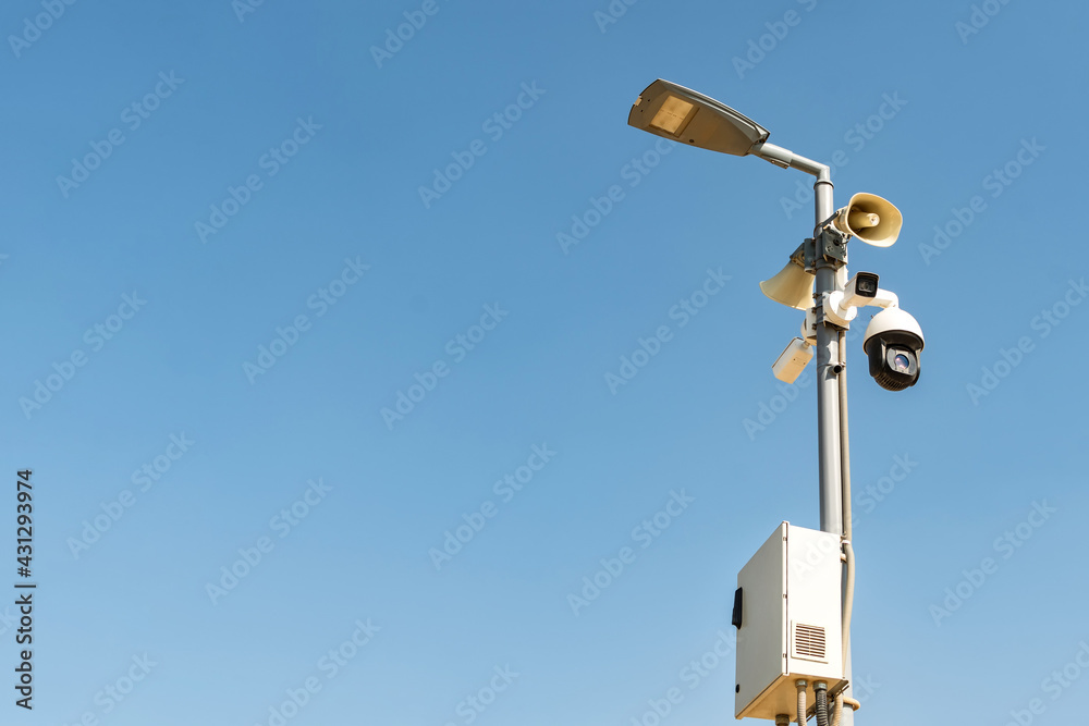 Cluster of security cameras on a lamppost, in an public Park on the sky background, with copy space. Cluster of security cameras on a lamppost, in an public Park on the sky background, with copy space.