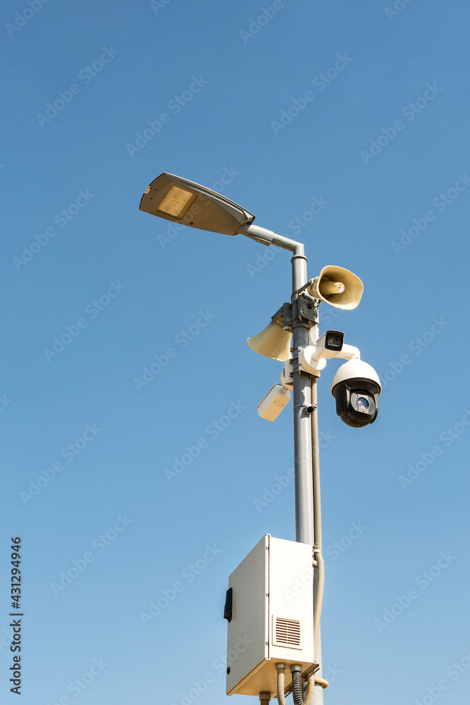 Cluster of security cameras on a lamppost, in an public Park on the sky background, with copy space. Cluster of security cameras on a lamppost, in an public Park on the sky background, with copy space.