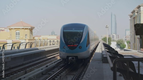 modern metro enter the station in Dubai city, UAE photo