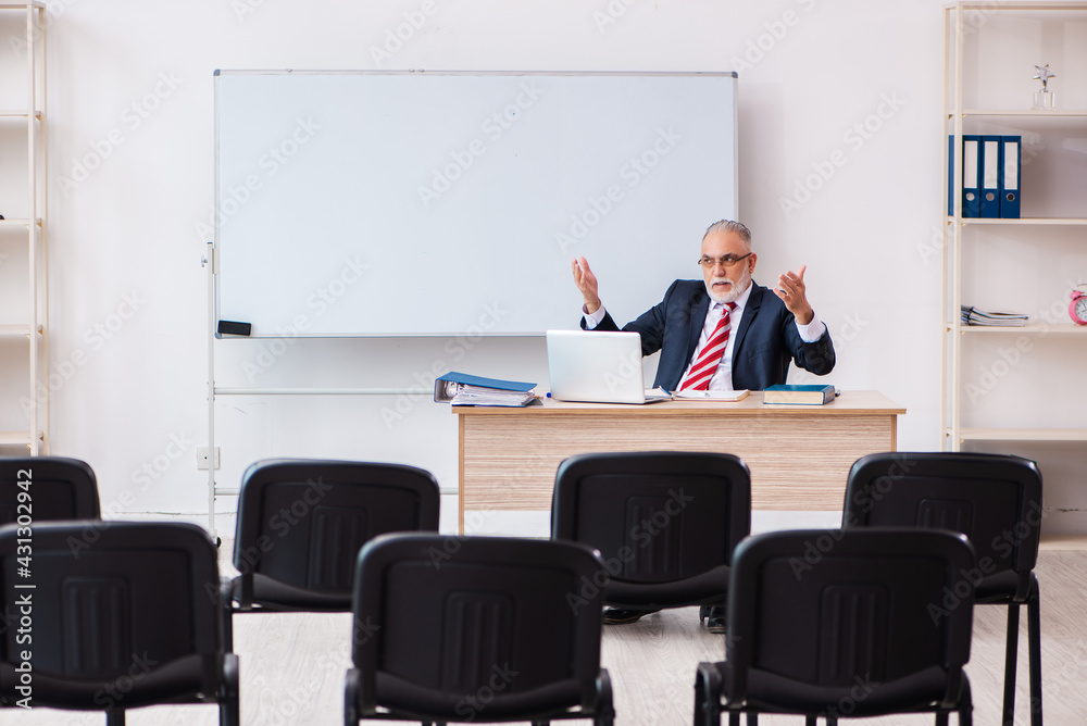 Old male business couch in the classroom during pandemic Old male business couch in the classroom during pandemic