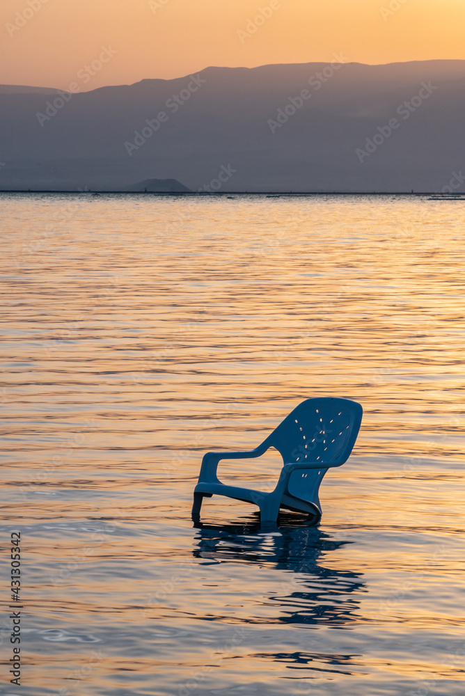 Chair people abandoned overnight in the Dead Sea in Israel
