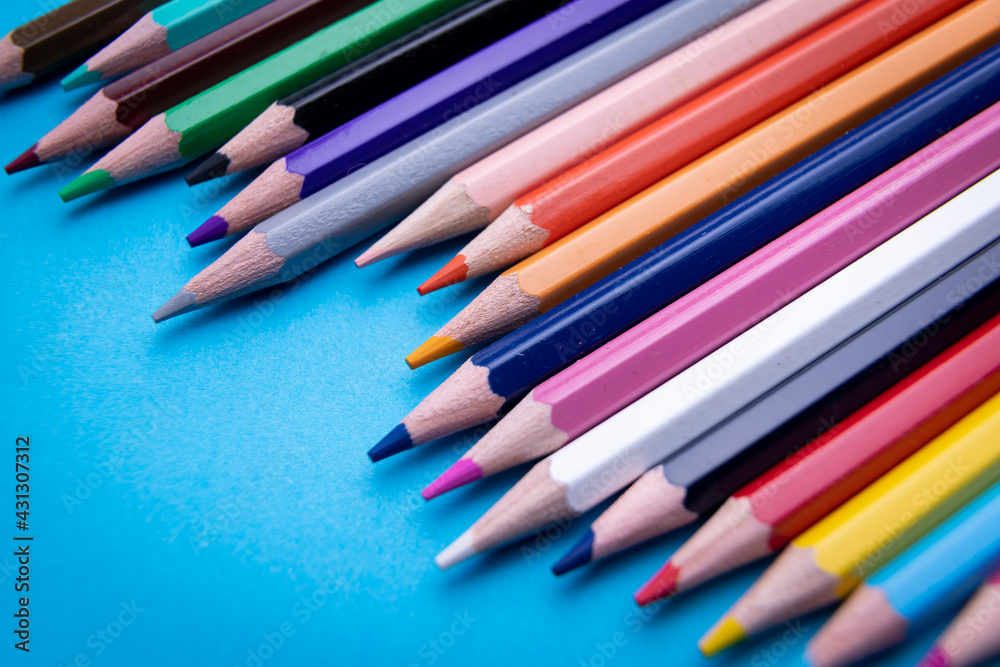 Colorful pencil set on blue background Colorful pencil set on blue background