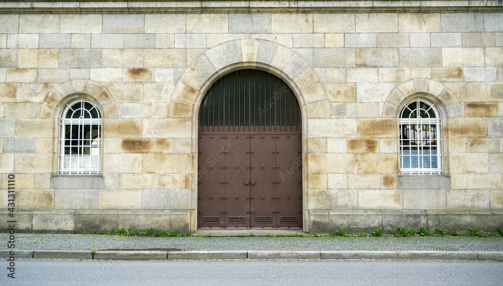 Old massive door with decorative door handle and lock, all still functional