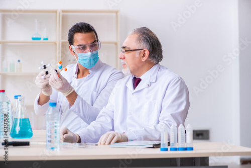 Two chemists working in the lab