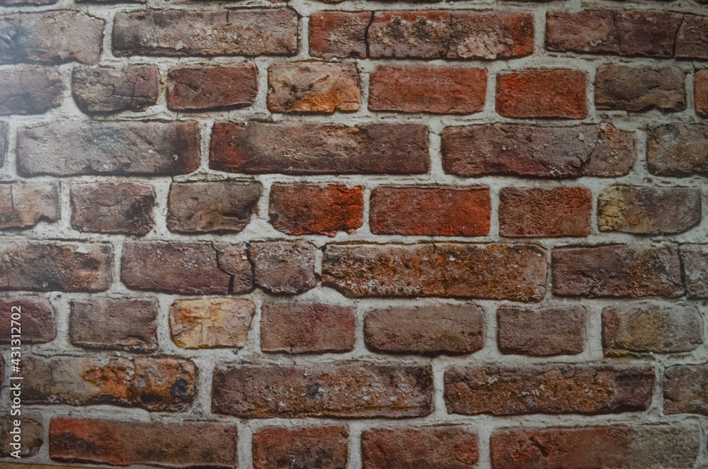 Obraz premium Wall, wallpaper made of dark brown orange red bricks, abstract wall background