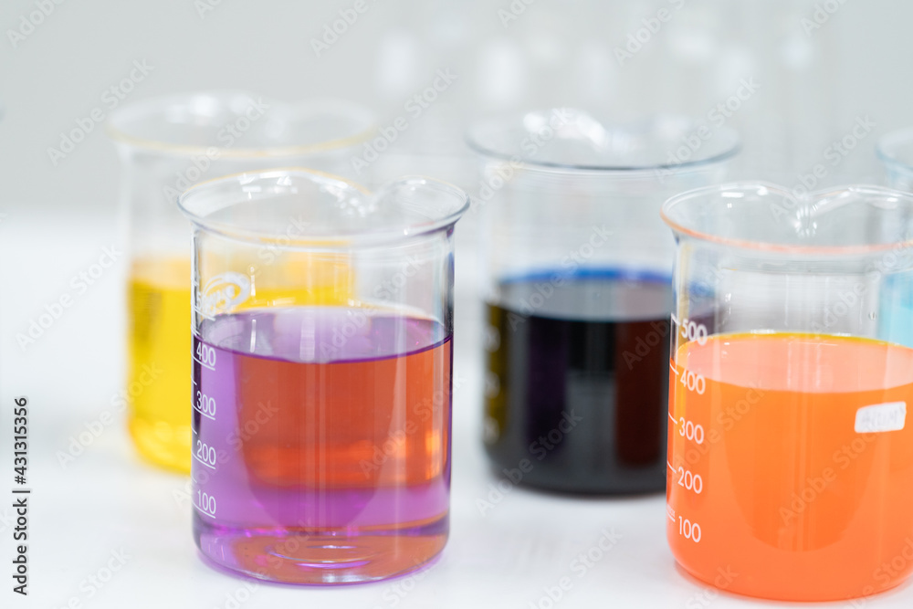 Close-up and selective focus shoot of a microscope, medical test tubes with liquid, and other modern laboratory equipment in a laboratory room. Education stock photo Close-up and selective focus shoot of a microscope, medical test tubes with liquid, and other modern laboratory equipment in a laboratory room. Education stock photo