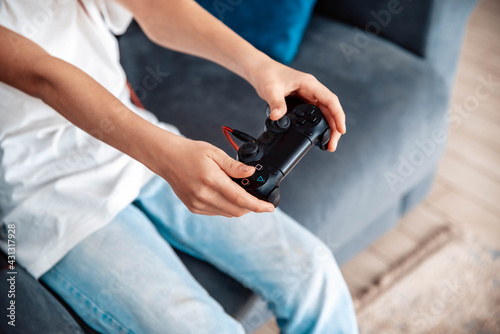Gamer holding gamepad, controller or videogame joystick console in hands - Video games and technology concept