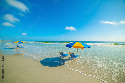 Parasols and beach chairs in Daytona Beach foreshore photo