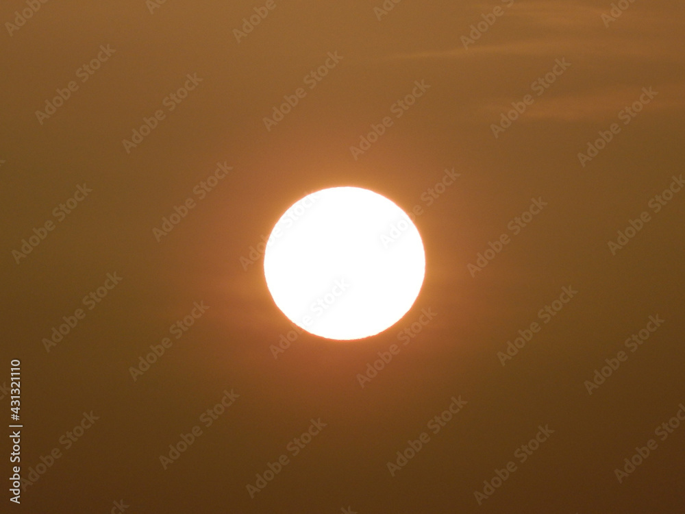 The sun, in the early hours of the day, offering orange and dark tones, dawning. The sun, in the early hours of the day, offering orange and dark tones, dawning.