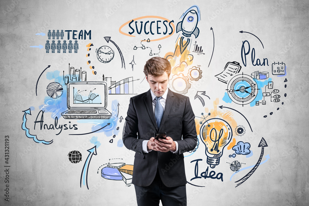 Businessman using phone and business strategy sketch on concrete wall Businessman using phone and business strategy sketch on concrete wall
