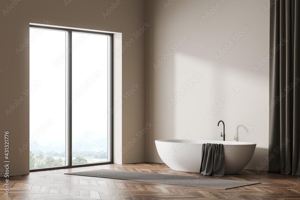 Bright bathroom interior with panoramic window and bathtub