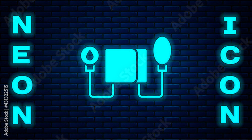 Glowing neon Blood pressure icon isolated on brick wall background. Vector