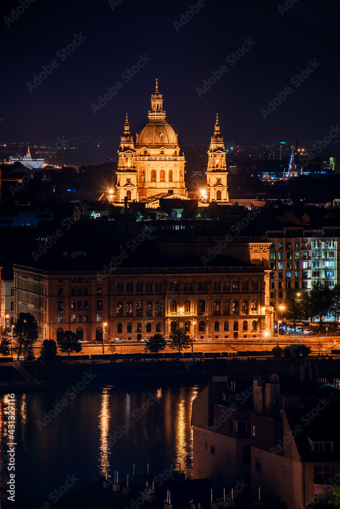 Hungary, evening twilight in Budapest, Ishtan Basilica on the background of night city lights, cityscape