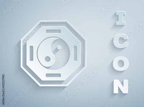Paper cut Yin Yang symbol of harmony and balance icon isolated on grey background. Paper art style. Vector