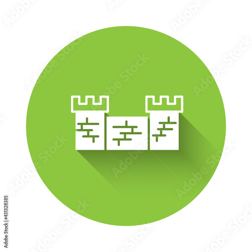 White Great wall of China icon isolated with long shadow. Green circle button. Vector