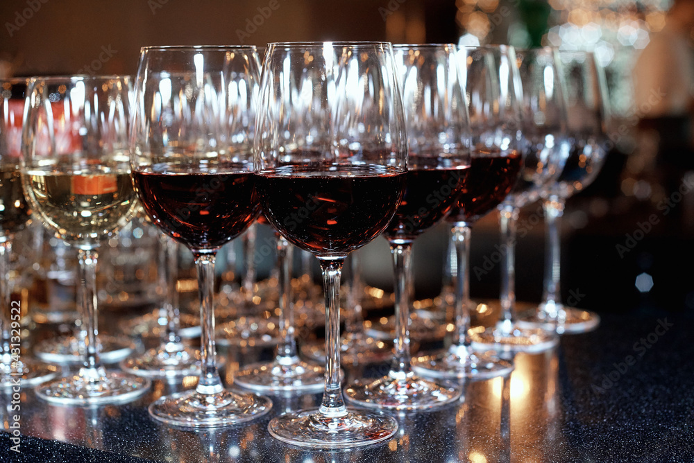glasses with red and white wine on the table