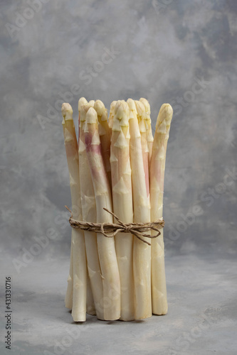 Bunch of white asparagus isolated on grey.
