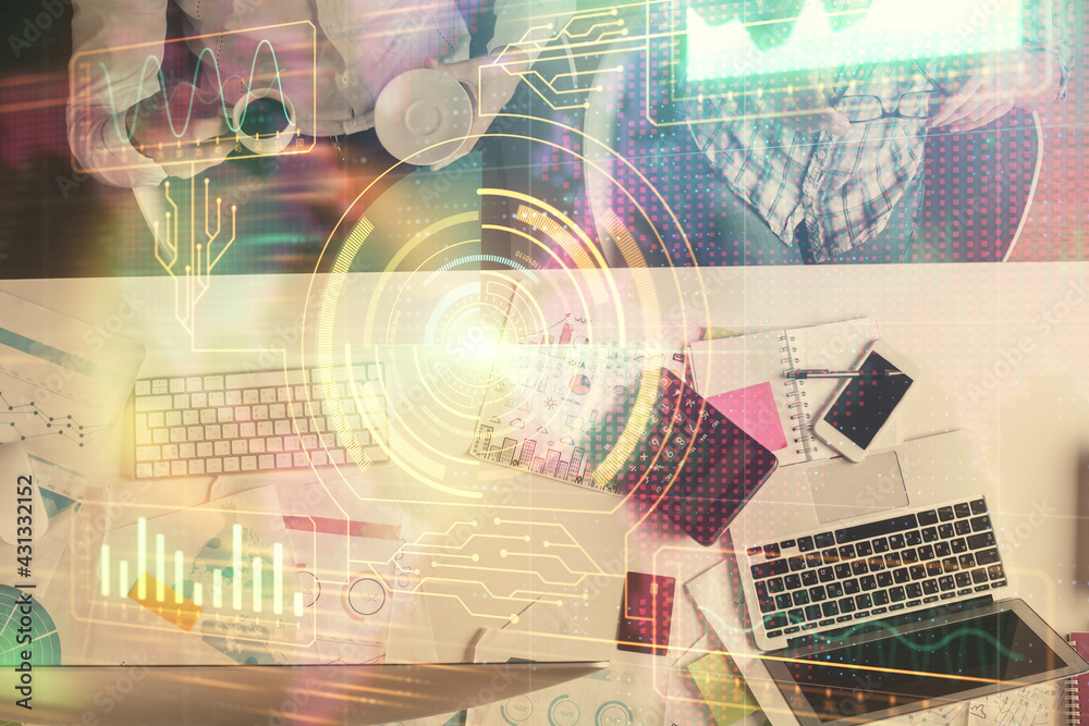 Double exposure of man and woman working together and data theme hologram drawing. Computer background. Top View. Double exposure of man and woman working together and data theme hologram drawing. Computer background. Top View.