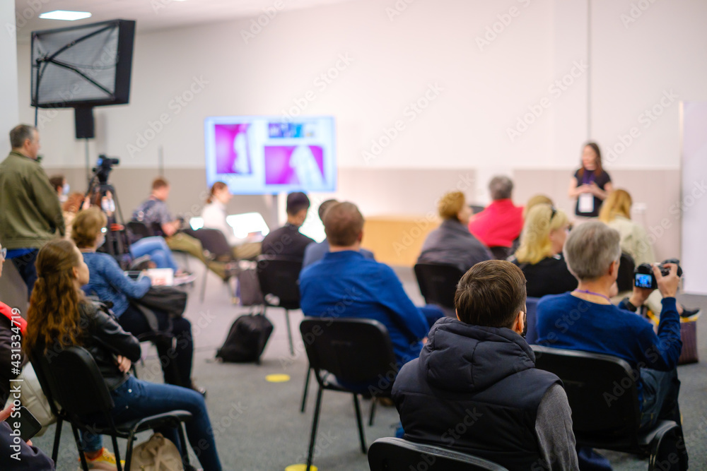 Business speaker doing presentation to audience