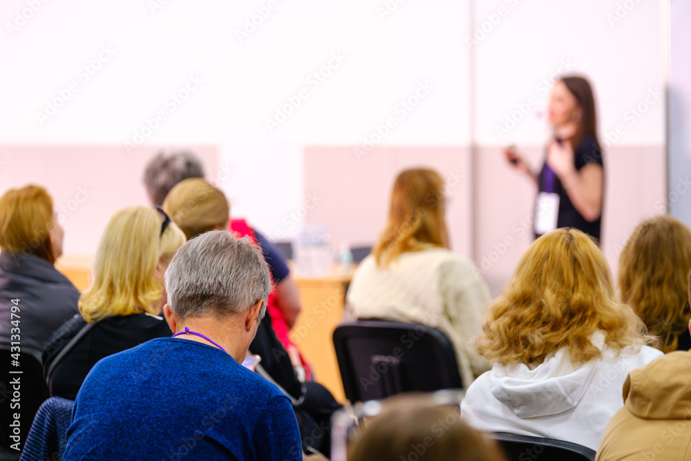 Business speaker doing presentation to audience