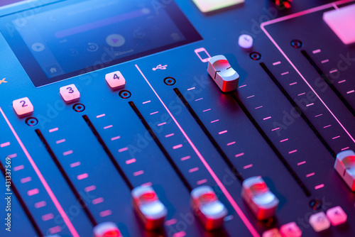 Professional podcast mixing console with faders and adjusting buttons, Audio sound mixer console. Sound mixing desk. Music mixer control panel in recording studio. podca mixer control  broadcasting