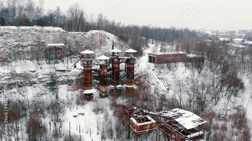  Liban Quarry - A historic site where prisoners were kept during Second World War. Old machines and piping equipment. Light snow-fall. High quality photo