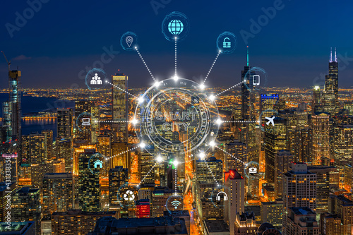 Technology connection line of Smart City over Chicago cityscape river side at the twilight time, network connection with wireless technology, centralized management and global communications concept