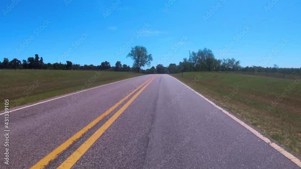 FPV driving on a rural country road with fence line in the country FPV driving on a rural country road with fence line in the country