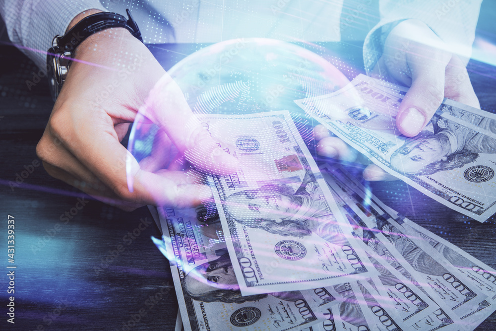 Multi exposure of Tech drawing hologram and USA dollars bills and man hands. Technology concept. Multi exposure of Tech drawing hologram and USA dollars bills and man hands. Technology concept.