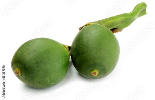 Green betel nuts over white background