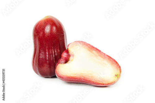 Depth of field. Group of Rose apple or Java apple or Syzygium seed with Full on wooden tray. isolated on white background. fruit flavors of sweet red gloss. Fresh fruit.