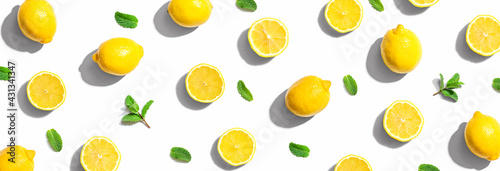 Fototapeta Naklejka Na Ścianę i Meble -  Fresh yellow lemons with mints overhead view