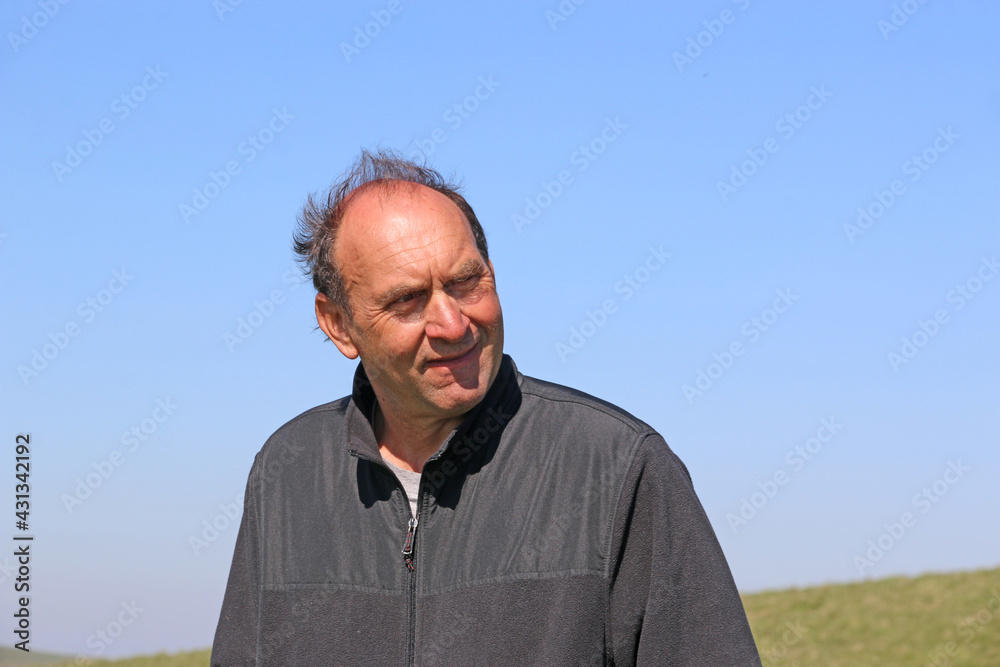 portrait of a man smiling outside