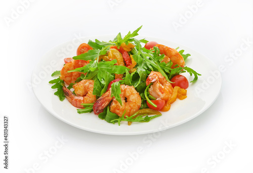 Delicious fresh shrimps salad with arugula and cherry tomatoes on a white background