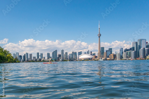 Photography The Toronto skyline seen from the Toronto Islands with a sea kayaker in the middle foreground