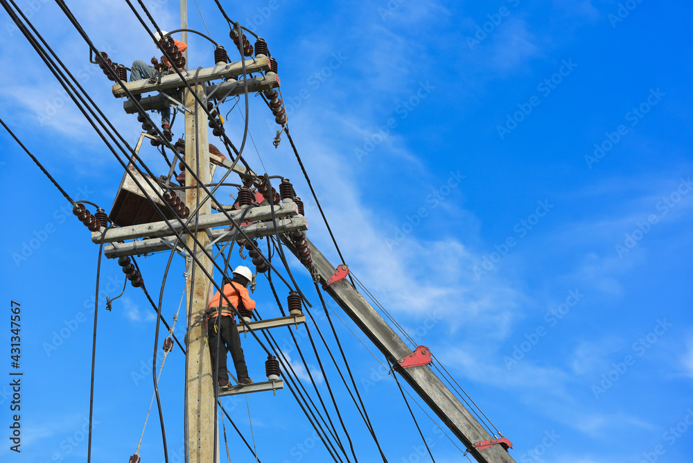 Team workers Electrician lineman repairing work on electric post power pole Team workers Electrician lineman repairing work on electric post power pole